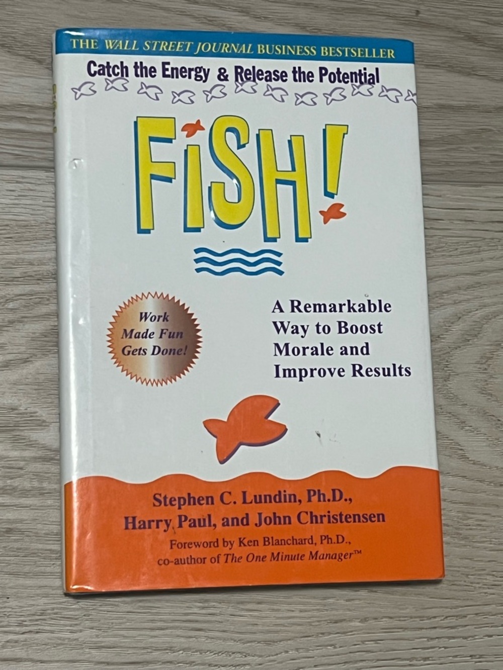 Fish! Book by Stephen C. Lundin - White and Orange Cover